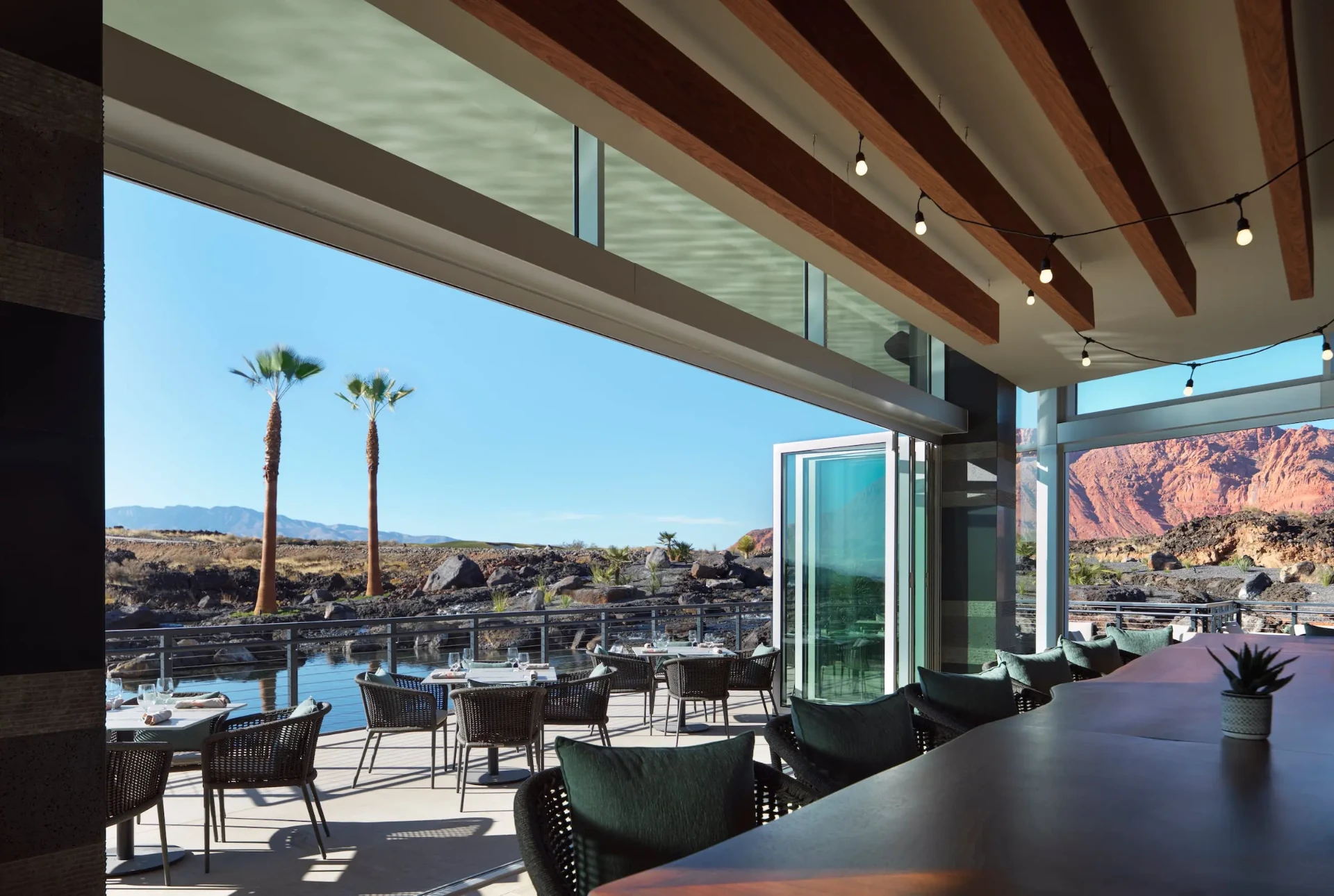Dining terrace overlooking lava fields and red cliffs